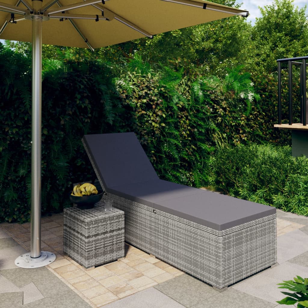 Sun lounger with cushion and coffee table in gray polyrattan