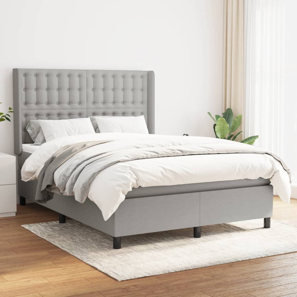 Spring bed frame with light gray mattress 140x190cm fabric