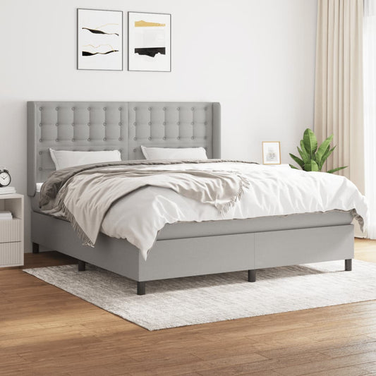 Spring bed frame with light gray mattress 180x200 cm fabric