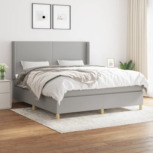 Spring bed frame with light gray mattress 180x200 cm fabric