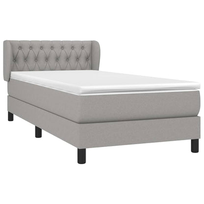 Spring bed frame with light gray mattress 90x200 cm fabric