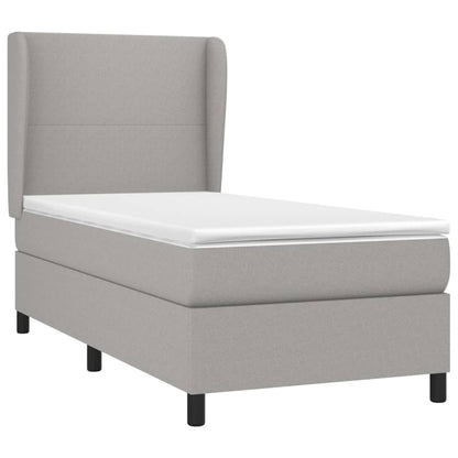 Spring bed frame with light gray mattress 90x200 cm fabric