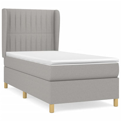 Spring bed frame with light gray mattress 90x200 cm fabric