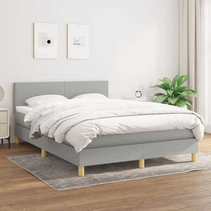 Spring bed frame with light gray mattress 140x200cm fabric